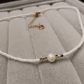 Choker necklace featuring white seed beads, a freshwater pearl, and golden square spacers - White Freshwater Pearl Necklace (38+5CM)