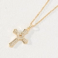 Gold cross pendant necklace with white zircon stones and thin chain on white texture - Gold Textured Full Diamond Cross (0100O)