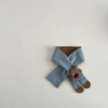 Detail of light blue knit scarf with brown trim and cute 3D bear ornament for toddlers - Scarf / Blue
