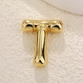 Macro shot of 18K gold plated balloon letter T pendant with polished bamboo texture finish - Letter T