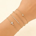 Detailed view of multilayer gold chain bracelets set with cross and heart pendants - Gold (DZ-947)
