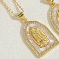 Detailed macro of gold Virgin Mary pendant with mother of pearl and cubic zirconia - Trapezoid Virgin Mary