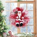 Christmas wreath with Santa Claus plush figure for festive window and wall decoration - Red Santa Claus