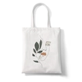 White canvas tote bag featuring minimalist face line art with orange and green accents - Style L (Green Shadow Face)