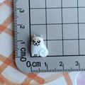 Detailed macro view of a 1.5cm white resin cat figurine with angry face for DIY crafts - White Demon