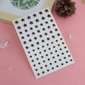 Self-adhesive black star face jewels sticker set for eyes makeup on pink fabric - Black Star Rhinestones