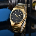 Detailed close-up of gold stainless steel watch with black checkered dial and date window - 1-Gold Case Black Dial