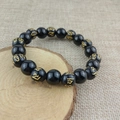 Obsidian bead bracelet with golden Six-Word Mantra symbols and elastic string - 10mm Six-Syllable Mantra Spacer Beads