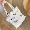 Detail of dachshund print tote bag in cream canvas with plush dog pendant accessory - Dachshund Shoulder Bag