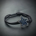 Elastic black hair tie featuring a sparkling star charm with blue rhinestones - Blue Pentagram