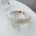 Elegant cream fabric headband with sparkling colorful rhinestones on a glass holder - Rhinestone Pleated