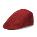 Detail view of the red and black mixed woven fabric texture on a vintage flat cap - One Size / Red