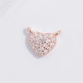 Detail of rose gold heart charm with pavé cubic zirconia and hanging connector loops - Rose Gold Double-Loop Heart Pendant