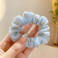 Macro detail of light blue floral chiffon scrunchie with soft ruffled fabric texture - Blue Lace Double Layer