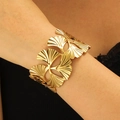 Macro detail of a wide gold ginkgo leaf cuff bracelet showing brushed metal textures - Ginkgo Leaf Shape Style (H-184)