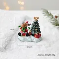 Miniature resin reindeer figurine with Christmas tree and red gift box on snowy base - Reindeer Tree