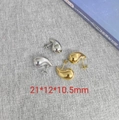 Macro shot of silver and gold teardrop earrings with precise 21x12x10.5mm dimensions - Water Drop / Steel