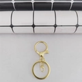 Dettaglio portachiavi dorato con chiusura a moschettone, anello piatto e connettore rotante - Chiusura a Forma di 8 Set di 3 Pezzi / Oro Chiaro