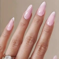 Glossy pink almond-shaped long press-on nails shown on hand with a smooth finish - Almond Shape / Glossy Pink