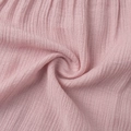 Detail of light pink crepe fabric showing natural crinkle texture and soft breathable material - S / Pink