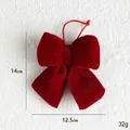 Red velvet Christmas bow pendant decoration with a hanging string on white fleece background - Small Bow
