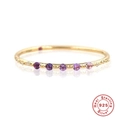 Detailed macro view of 925 sterling silver ring with gradient purple gemstones and gold finish - Purple Zirconia 5-Stone Row Pavé Gold Style (Style 10-Purple)