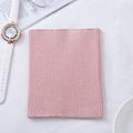 Pink cashmere knit neck warmer with elastic ribbed texture in a flat lay display - Dusky Pink