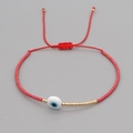Bohemian evil eye bead bracelet with red woven cord and golden metal accents - Red Rope Evil Eye Red Beads (MI-B200498P)
