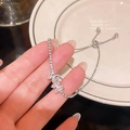 Detailed macro view of the silver butterfly bracelet with white zircon butterfly charms - S396 Silver