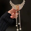 Elegant gold butterfly hair claw clip with tassels, white rhinestones and pearls for women - Zirconia Style