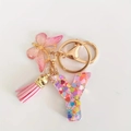 Pink sequin resin letter Y keychain with butterfly and tassel charm in gold finish - Letter Y