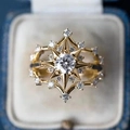 Vintage sunburst gold ring with central zircon in a blue jewelry box display - US 6 / Gold