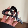 Close-up of a matte black heart-shaped hair claw clip held in hand for detail - Matte Black Heart Claw Clip