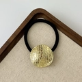 Elastic hair tie with a textured round golden metal charm in a modern nest design - Textured Round Gold