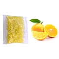 Orange scented cat litter deodorizing beads in a transparent bag with fresh orange fruit - 10g (Lemon)