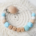 Blue and white beech wood pacifier clip with silicone beads and BABY letter blocks - Blue