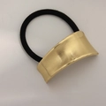 Minimalist elastic hair tie featuring a golden striped metal arc charm for ponytails - Arched Asymmetric Side Gold