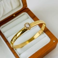 Gold-tone stainless steel open bangle with pear-shaped cubic zirconia in a jewelry box - 6mm Water Drop Zirconia Style / Gold