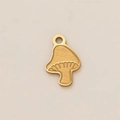Gros plan détaillé d'un pendentif champignon plaqué or 18 carats à texture lisse - Pendentif Champignon