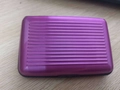 Slim purple aluminum credit card holder with anti-slip ridges and RFID blocking protection - Pink