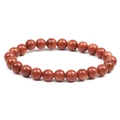 Macro shot of natural goldstone beaded bracelet showing detailed mineral texture and gloss - Gold Sandstone