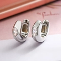 Minimalist silver huggie earrings featuring large oval-cut cubic zirconia in U-shaped design - Silver
