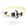 Detailed shot of hand-knitted cream Milan cord with a black sea turtle clasp - Black Sea Turtle Buckle / Off White Cord Sea Turtle