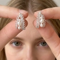 Detail shot of boho-style hollow drop earrings featuring three graduated pearls in silver - 22# 925 Sterling Silver Earring Post-Silver-Hollow Pearl Tassel