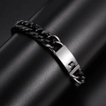 Detailed close-up of matte black link bracelet with polished silver clasp for men - Black