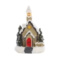 Detail of Christmas miniature cottage with red door, faux snow, and a small green tree - Red Door Cottage Style