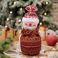 Knitted Christmas drawstring gift bag with a 3D snowman head and striped hat - Snowman