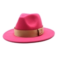 Detail of rose red wool fedora hat featuring a khaki ribbon and golden bee buckle - Rose Red