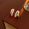 Close-up of gold C-shaped twisted pearl earrings displayed on a brown leather jewelry box - S925 Silver Pin Style (Gold)