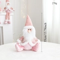 Detail shot of a sitting pink Santa plush doll with sequin fabric on a white surface - Pink Sitting Santa Claus / Height 35cm/Weight 270g